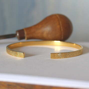 Pulsera Rusk Plata con baño de Oro
