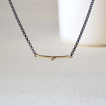 Colgante Nit Diamante y Oro y Plata