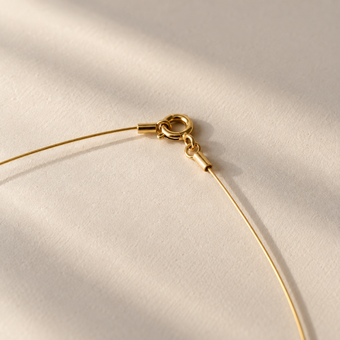 Gargantilla plata con baño de oro y cable de acero